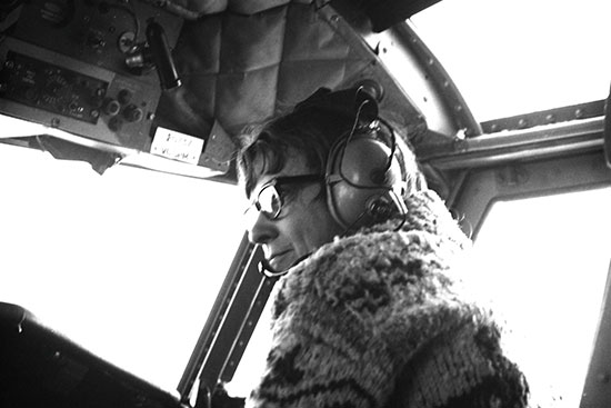 A woman in an aircraft cockpit.
