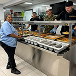 Volunteers in CFB Suffield serving their NDWCC Spaggetti lunch. MS Celiz, Capt Smallwood, Sgt Hempstock, and Participant.