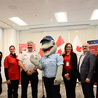 The Canadian Coast Guard's official launch event featuring Cdr Frederic Bard, Michelle Snowden, Mario Pelletier, Echo, Tara Furnivall, David Musseau and Kathleen Olson.