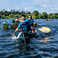 Canoe team 7 Comm HQ followed closely by team The Liti-Gators.