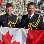 Proudly displaying the RMC flag and the National Flag of Canada in Valparaiso, Chile (from L to R): LCdr Gary Jackson, NCdt Mikhael Zavala Thyer, NCdt Justin Norman, OCdt Willem Quist, OCdt Spencer Talerico, NCdt Jamie De Lachevrotière-Martin, and Canadian Military Attaché Capt(N) Navy Erik Tremblay.