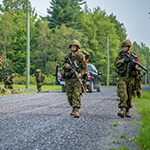 Candidates on patrol during a training scenario at the Farnham Base