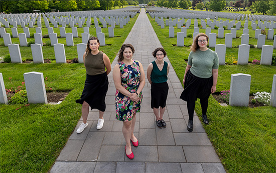 The four members of the Casualty Identification Program team stand in Beechwood cemetery.