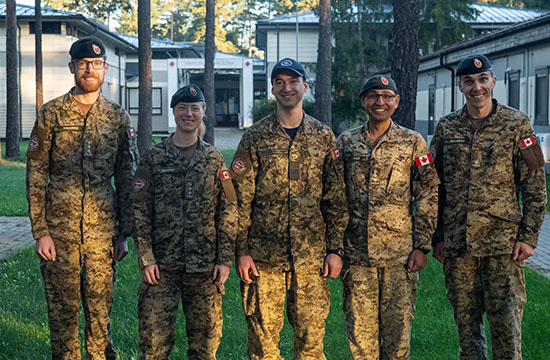 Five Canadian Pharmacy Officers in uniform standing outdoors in Latvia.