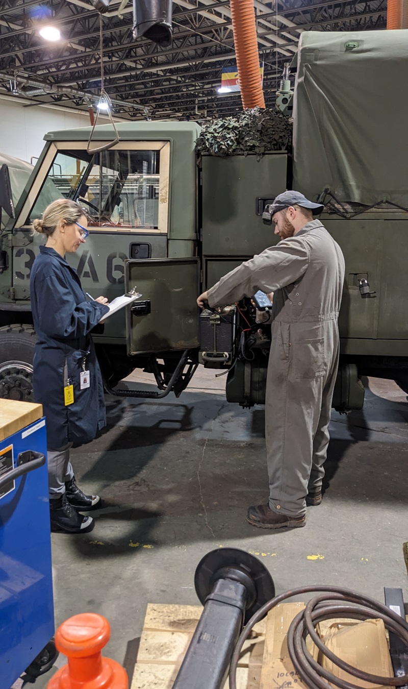 Occupational therapist evaluates a vehicle technician’s worksite during return-to-duty assessment.