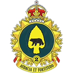 A Canadian Army insignia featuring a crown above a green circular emblem with a black bear on a yellow background. The badge is set on a starburst design, with the number “2” and the motto “Audacia et Fortitudo.”