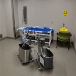 A hydrotherapy treatment room containing a treatment table, shower equipment, and therapeutic bathing equipment used for patient care and treating frostbite.