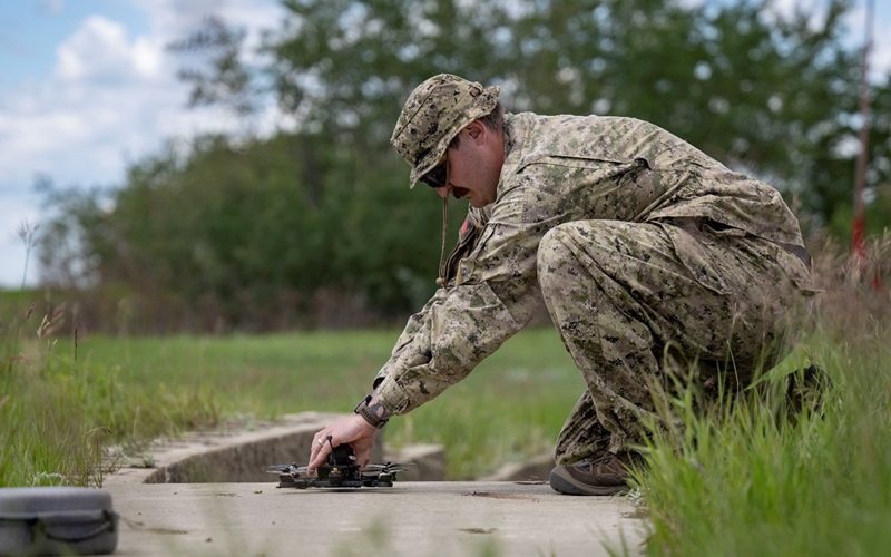 Candidate on the FMUAS Operator Course prepares an FPV drone for flight.