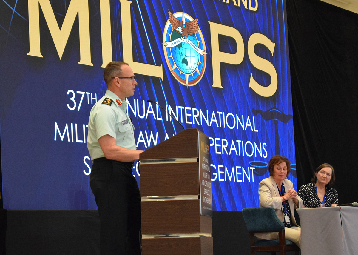 Lieutenant-General Derek Macaulay speaks at a podium during a MILOPS 2026 panel.