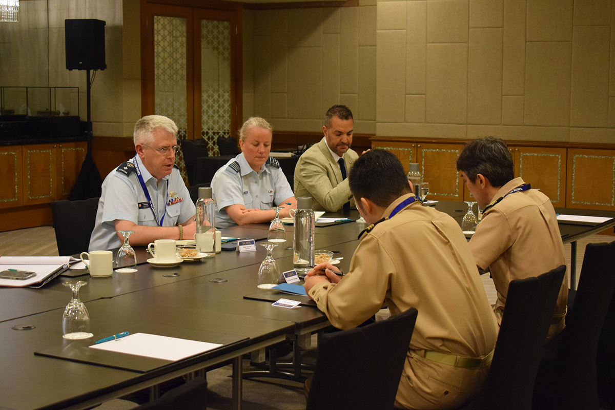 Major-General Robin Holman and Canadian Defence Team members meet with Japan Maritime Self-Defense Force legal officers.