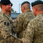 1 Cdn Div HQ member Captain Johnson greets Division Sergeant Major Lapointe after receiving the new Canadian Joint Response Force Headquarters patch.