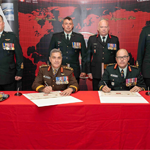 Commander CJOC, LGen. J.M.S. Boivin and Commander Canadian Army, LGen. M.C. Wright sign the transfer of command authority for the 1 Cdn Div, with CWO P. Gagné, CWO J.R.D. Lapointe, Col. T.D Marcella, and CWO J.C. Robin (from left to right standing).
