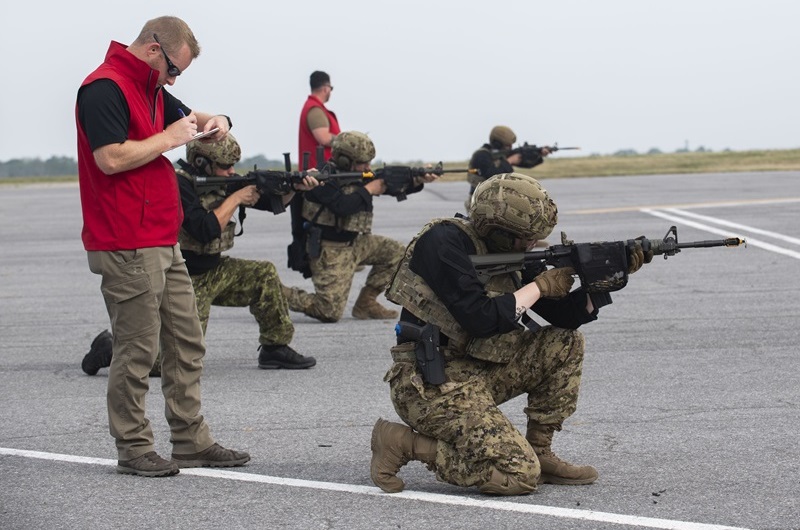 Members of the Canadian Armed Forces conduct training designed to protect a CC-130J Hercules as part of the Aircraft Security Officer Course at 8 Wing Trenton.