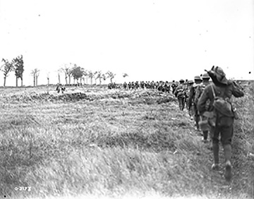 Canadians advancing through a German barrage. Advance East of Arras. September, 1918.