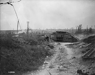 This photograph shows a Mk. V female tank advancing across a sunken roadway on the Arras front. Advance East of Arras. September, 1918. 