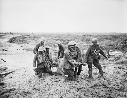 Battle of Pilckem Ridge. Stretcher bearers struggle in mud up to their knees to carry a wounded man to safety near Boesinghe.
