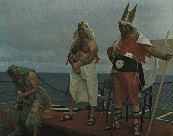 2 soldiers disguised as King Neptune and Queen Amphitrite standing on the ship's deck.