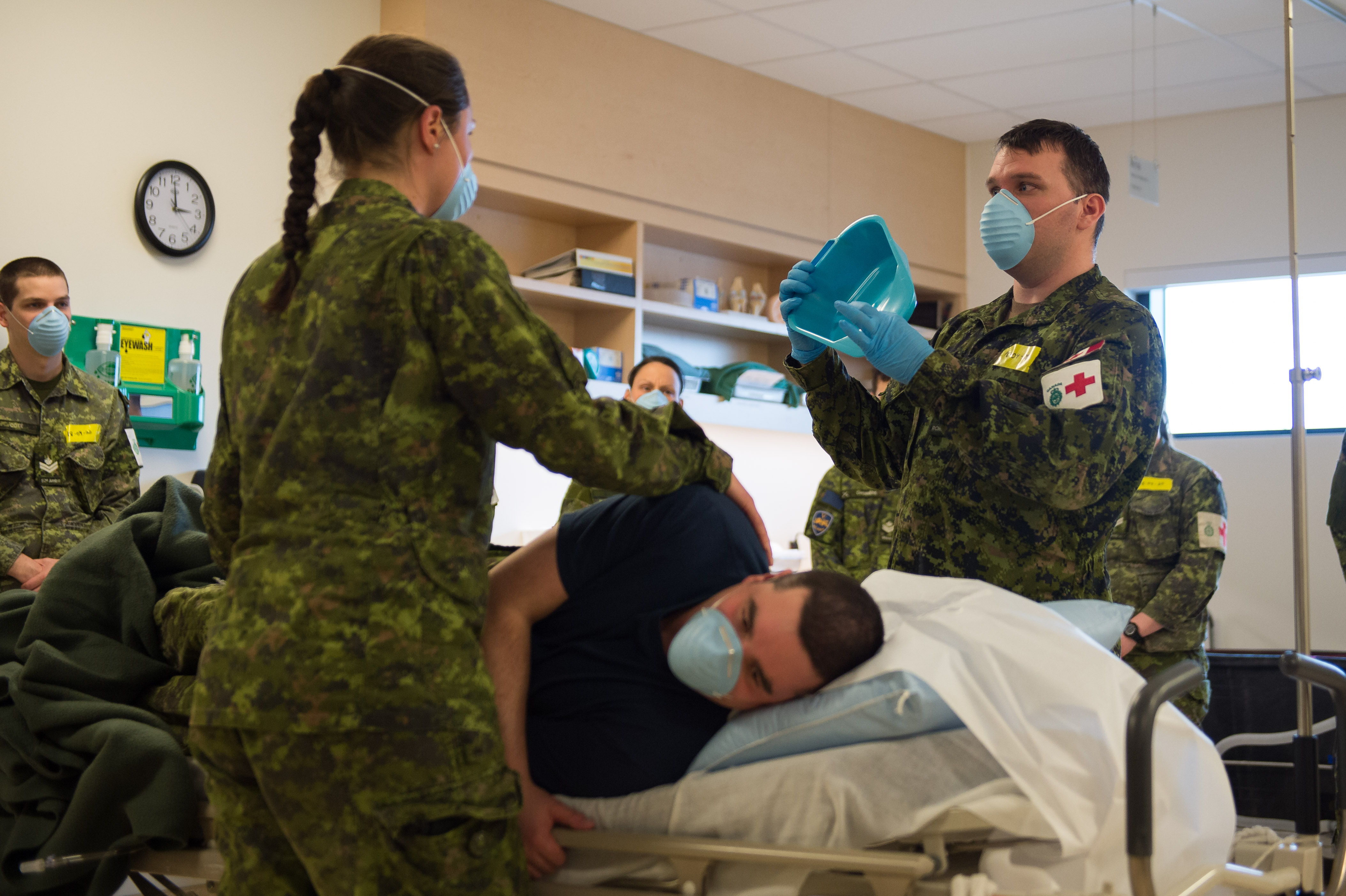 Members of the 4 Health Services Group (4 H Svcs Gp) receive training in order to assist the civil authorities in the LTCFs during Operation LASER at the Saint-Jean Garrison on April 18, 2020.