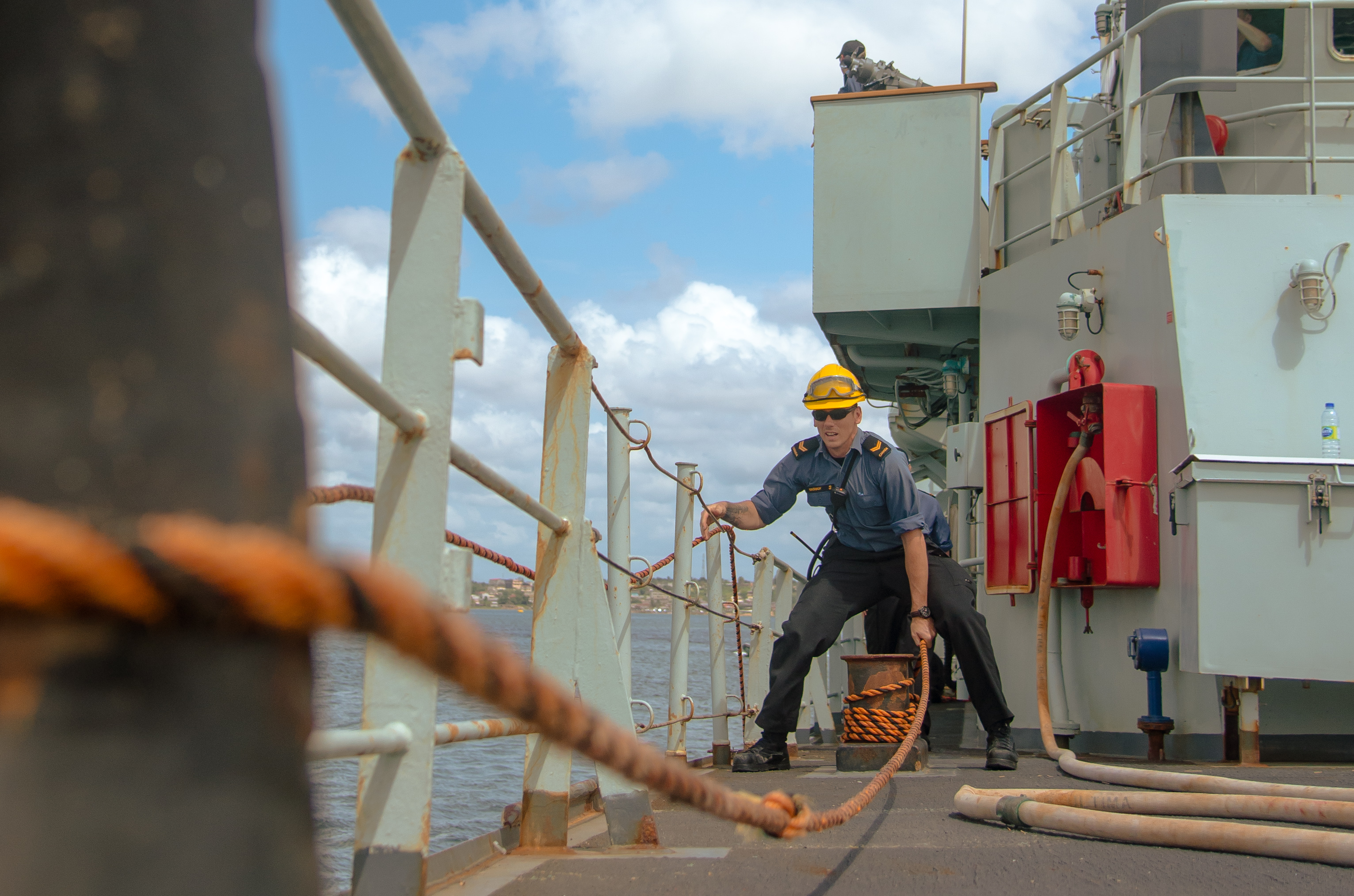 March 7, 2018. Leading Seaman Justin Washnuk, a boatswain onboard Her Majesty’s Canadian Ship (HMCS) SUMMERSIDE prepares the bowline for the zodiac to come alongside and be recovered as the ship for departs Abidjan, Côte d’Ivoire during Operation PROJECTION on March 7, 2018. Photo: Petty Officer 2nd Class Peter Reed, Formation Imaging Services- Halifax