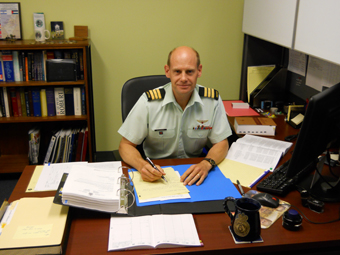 Legal officer works on papers relating to military justice.