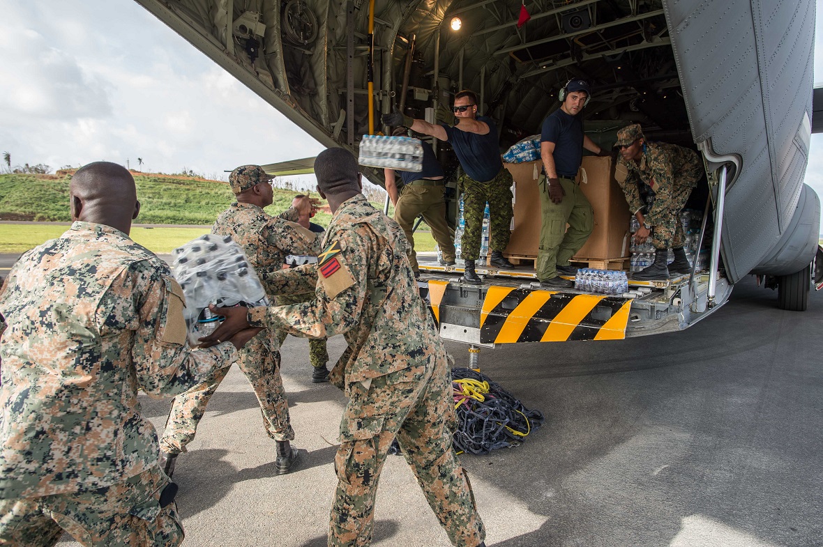 Members of the Canadian Armed Forces and the Jamaican Defence Forces Disaster Assistance Response Team load supplies into the CC-130J Hercules in Kingston, Jamaica on September 27, 2017 during Operation RENAISSANCE IRMA-MARIA. Photo: Corporal Gary Calvé.