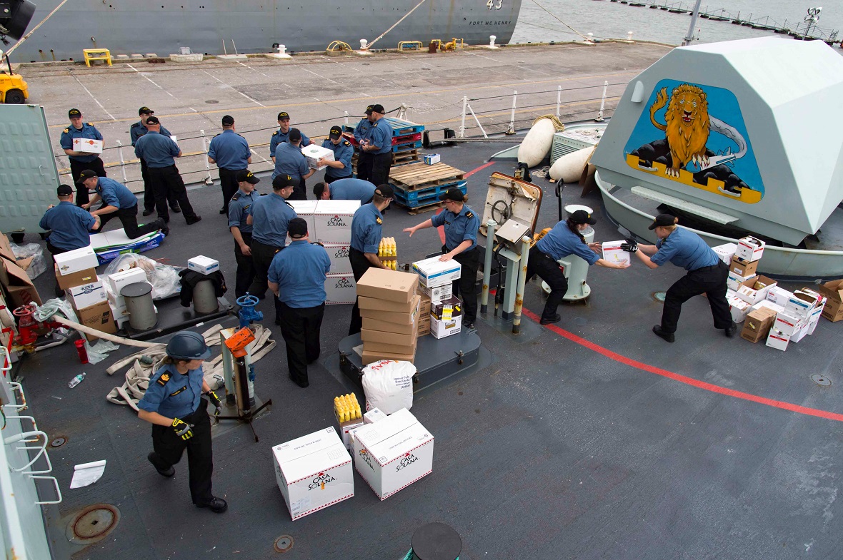 Crew members from HMCS ST. JOHN'S receive supplies at Norfolk Naval Base in West Virginia before departing on Operation RENAISSANCE to assist in humanitarian relief efforts following Hurricane Irma, September 11, 2017. Photo by: MCpl Chris Ringius, Formation Imaging Services