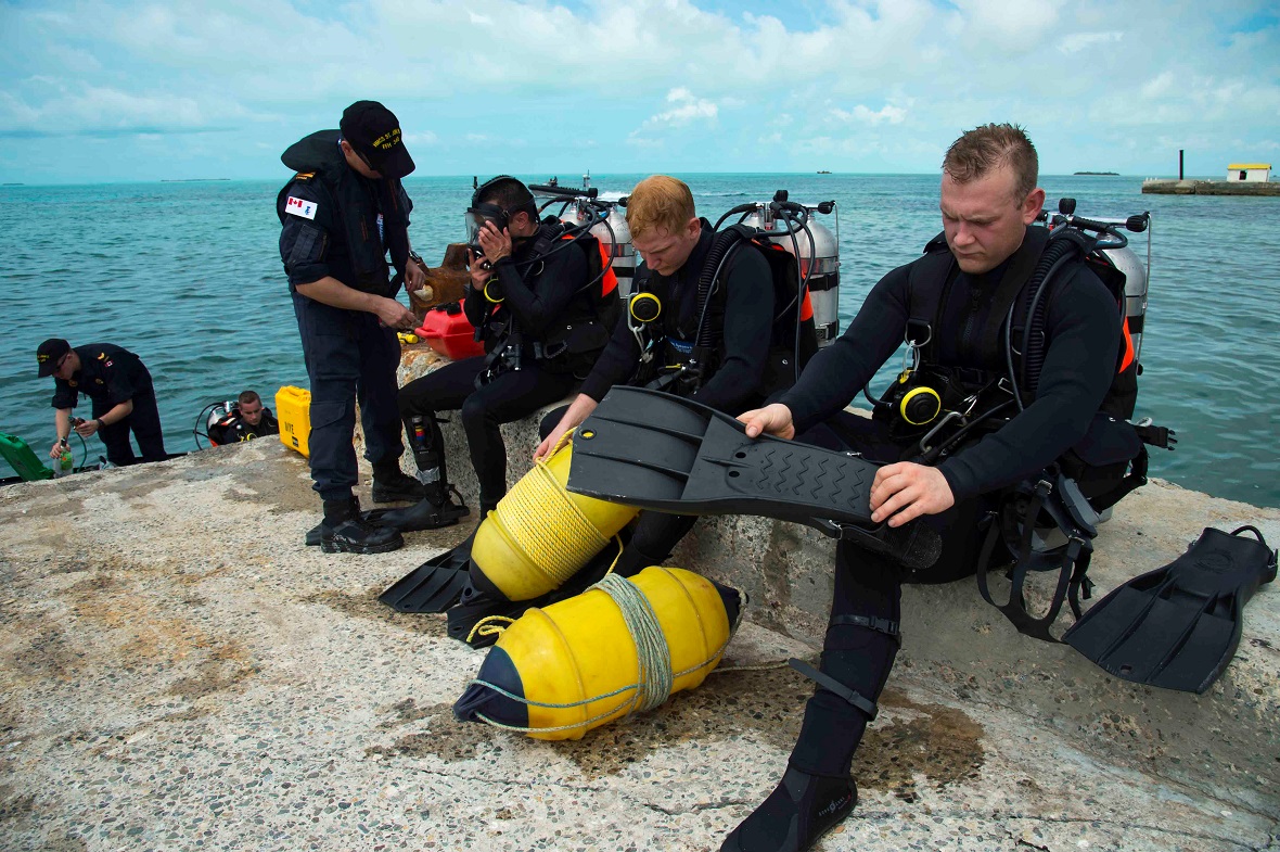 September 17, 2017. Divers from Her Majesty’s Canadian Ship St. John’s prepare to inspect a jetty on South Caicos Island during Operation RENAISSANCE, the Hurricane Irma humanitarian aid mission in the Caribbean, on September 17, 2017. Photo: MCpl Chris Ringius, Formation Imaging Services Halifax.