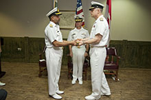 Commodore Bilal Abdul Nasir, Pakistan Navy (left) hands over command of Combined Task Force  150 (CTF 150 ) to Commodore Haydn C. Edmundson, Royal Canadian Navy (right) while Vice Admiral Kevin M. Donegan, Commander, U.S. Naval Forces Central Command, U.S. 5th Fleet, Combined Maritime Forces (centre) presides on December 8, 2016 at Naval Support Activity, Manama, Bahrain. CTF 150 is one of three task forces operated by Combined Maritime Forces. Its mission is to promote maritime security in order to counter terrorist acts and related illegal activities, which terrorists use to fund or conceal their movements.