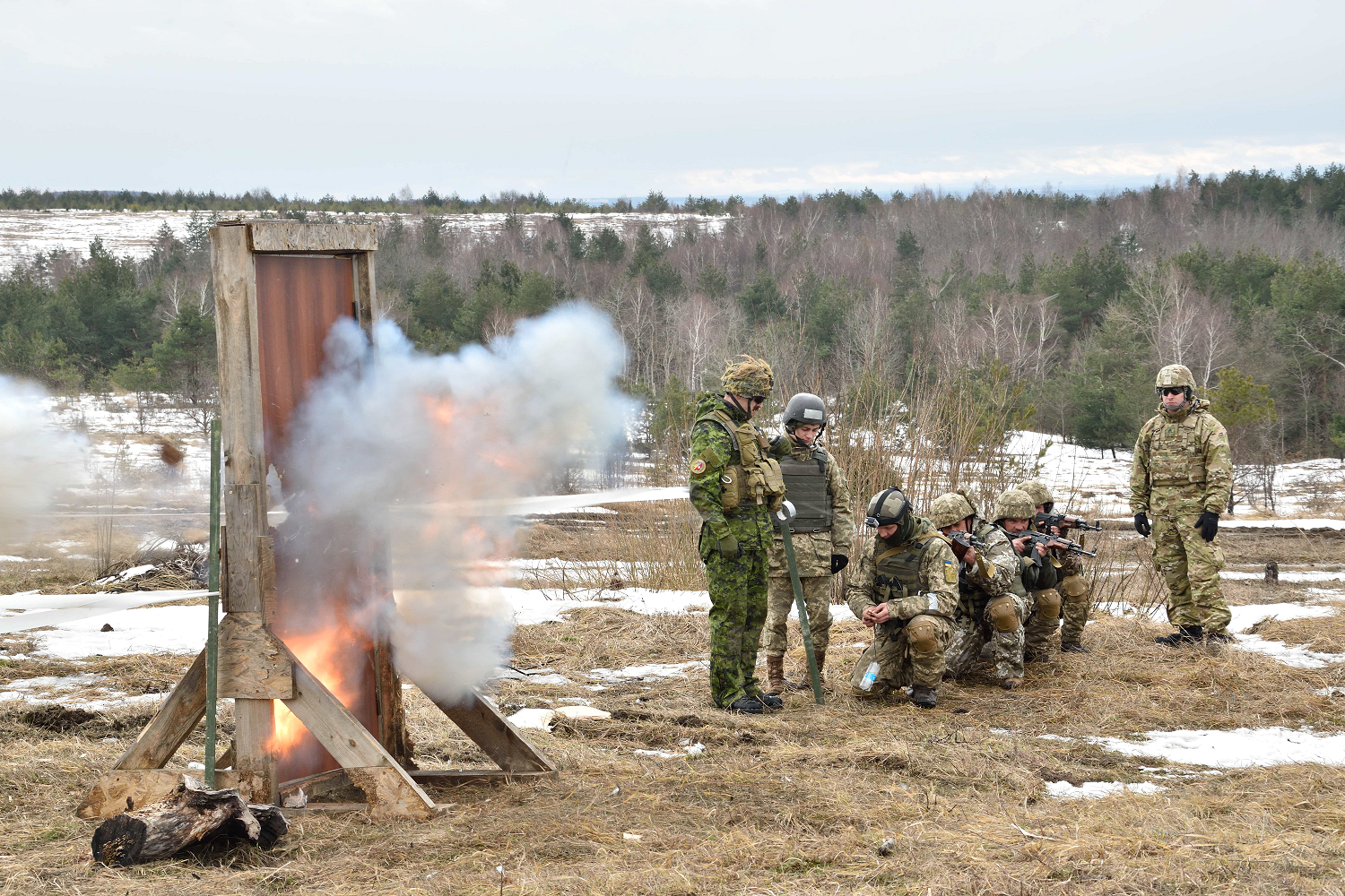 February 23, 2017. A Ukrainian soldier detonates a charge during explosive door breaching practice with Canadian and American combat engineer instructors of Joint Task Force – Ukraine during Operation UNIFIER at the International Peacekeeping and Security Centre in Starychi, Ukraine on February 23, 2017. (Photo: Joint Task Force – Ukraine)