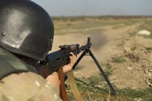 Starychi, Ukraine. 17 September 2015 – A member of the Ukrainian Forces shoots a Ruchnoy Pulemyot Kalashnikova (RPK) machine gun on a firing range during Operation UNIFIER at the International Peacekeeping and Security Centre (IPSC). (Photo: Canadian Forces Combat Camera, DND)
