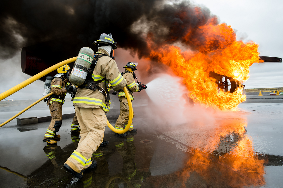 May 27, 2017. Royal Canadian Air Force firefighters from Air Task Force-Iceland (in front) and Keflavik International Airport firefighters conduct an airfield crash exercise as part of readiness training in Keflavik, Iceland during Operation REASSURANCE on May 27, 2017. (Photo: Corporal Gary Calvé, Imagery Technician ATF-Iceland)