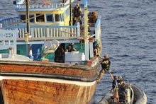 Arabian Sea, 18 December 2012 – Members of HMCS Regina’s boarding party board a dhow for inspection during Operation ARTEMIS. (Photo by Cpl Rick Ayer, Formation Imaging Services, Halifax)
