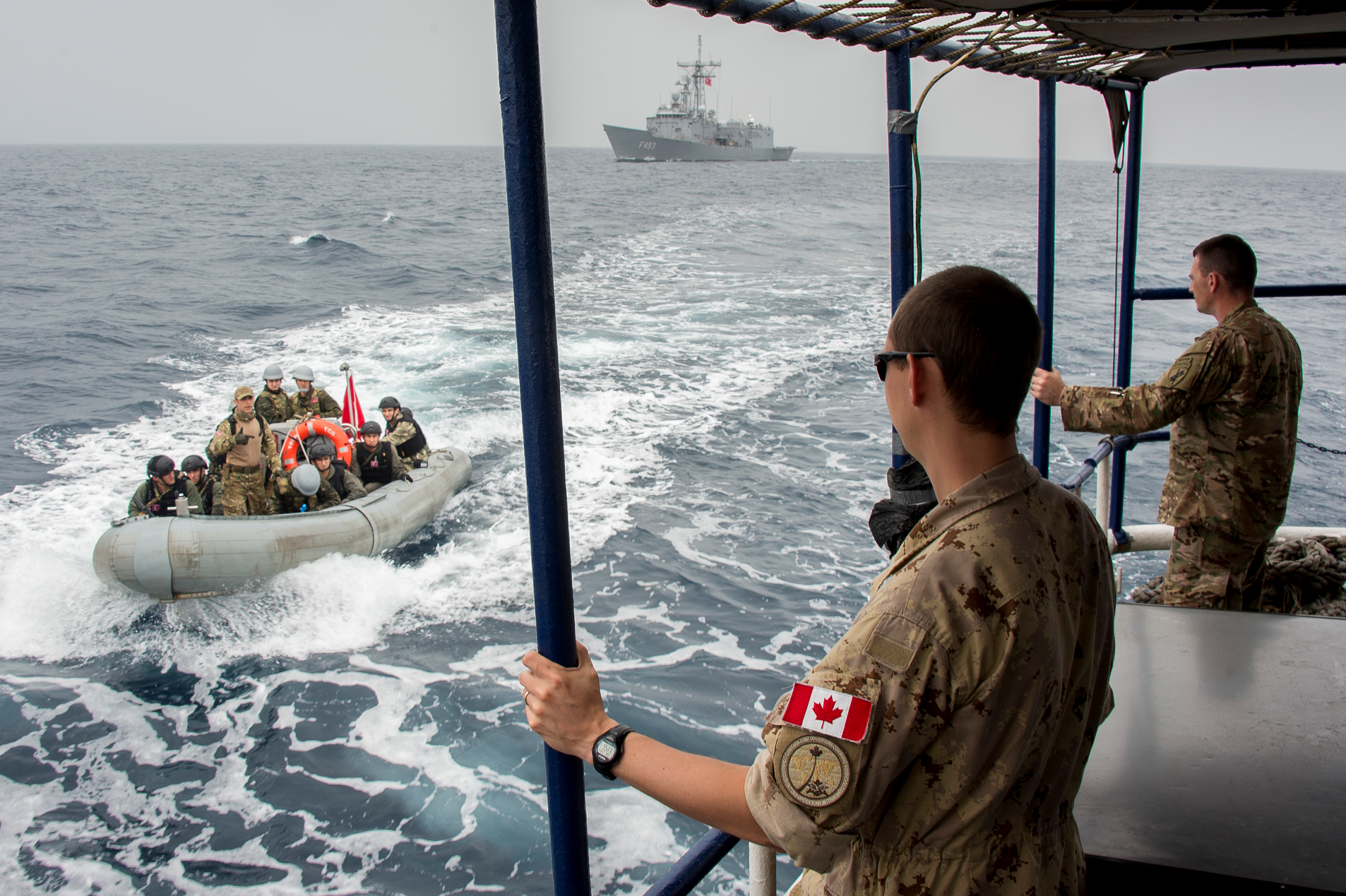 February 4, 2017. Lieutenant-Navy François Gaudreault observes the Turkish boarding party boat approaching the target vessel during Exercise CUTLASS EXPRESS on February 4, 2017 in Djibouti, Africa. (Photo: Master Corporal Mathieu Gaudreault, Canadian Forces Combat Camera)