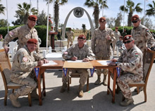 The commanders of the Military Police of the Canadian and Hungarian contingents, as well as the Commander of the Multinational Force and Observers, sign the responsibility transfer documents on 23 March 2015 at the North camp of the MFO, in Sinai, Egypt. Photo credit: Sgt Tom Duval, US Army