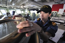 Caribbean Basin, 1 February 2011 - Sub-Lieutenant Amanda Jayne, a Canadian Forces Maritime Surface and Sub-surface (MARS) Officer, uses the ship’s compass to range find a vessel of interest, while Her Majesty’s Canadian Ship (HMCS) Toronto patrols her area of operations in the Caribbean Basin. (Photo Credit: Private Dan Bard, Formation Imaging Services, CFB Halifax)