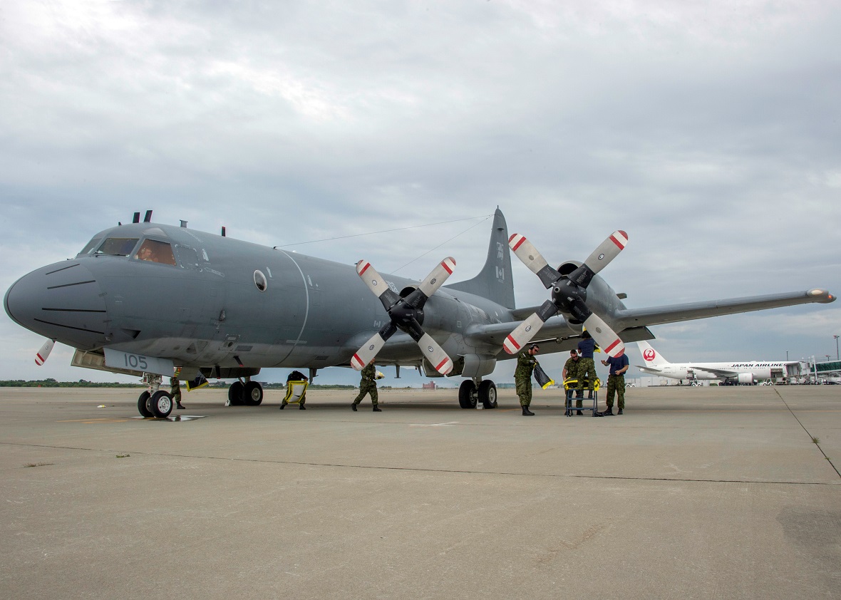 The ground crew for the CP-140 Aurora prepares the aircraft for its daily mission on Operation DRIFTNET in Hakodate, Japan on July 12, 2017.   Photo: Sergeant Shilo Adamson, CFB Borden