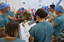 Northern Iraq. November 7, 2016 – Canadian Armed Forces and Norwegian Army medical personnel attend to a simulated patient at the intensive care unit of the Role 2 medical facility in Northern Iraq during an exercise scenario while deployed on Operation IMPACT. (Photo: Op IMPACT, Canadian Forces Combat Camera) Photo has been digitally altered to protect operational security.