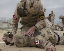 Kuwait. 27 Jan 2016 – Canadian Armed Forces Military Police and firefighters participate in a Combat First Aid Course given by the United States Marine Corps during Operation IMPACT.  (Photo: Op IMPACT, DND)