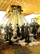 Members of 38 Canadian Brigade Group’s Domestic Response Company fill sandbags at Portage la Prairie maintenance yards during Operation LENTUS on July 07, 2014. Photo: Corporal Darcy Lefebvre, Canadian Forces Combat Camera