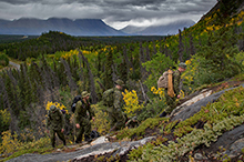 August 29, 2016. Canadian Armed Forces members from 43 Fighting Troop, 12e Régiment blindé du Canada (12 RBC) hike Paint Mountain to do a damage assessment of a communications antenna at the peak in Haines Junction, Yukon during Operation NANOOK on August 29, 2016. (Photo: Cpl Chase Miller, CFSU(O) - Imaging Services)