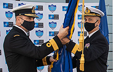 Caption: Commodore José António Mirones of the Portuguese Navy hands over the NATO flag to Commodore Bradley Peats of the Canadian Armed Forces during a Standing NATO Maritime Group One change of command ceremony held on board Her Majesty’s Canadian Ship Halifax in Lisbon, Portugal on January 18, 2021.