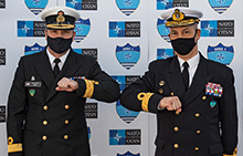 Caption: Commodore Bradley Peats of the Canadian Armed Forces and Commodore José António Mirones of the Portuguese Navy touch elbows during a Standing NATO Maritime Group One change of command ceremony held on board Her Majesty’s Canadian Ship Halifax in Lisbon, Portugal on January 18, 2021.