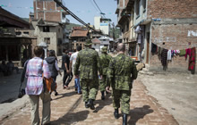 A representative from Canada's Department of Foreign Affairs, Trade and Development and other non-government organization partners take part in a reconnaissance patrol with members of the initial elements of the DART in Kathmandu, Nepal on May 1, 2015.  Photo: Captain Gabriel Rousseau, Canadian Forces Combat Camera