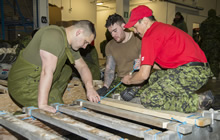 Resolute Bay, Nunavut. 3 April 2016. Members of 2nd Battalion, The Royal Canadian Regiment are taught how to prepare a Komatuk sled by a member of 1st Canadian Ranger Patrol Group at Resolute Bay, NU, in preparation for Operation NUNALIVUT on April 3, 2016. (Photo: Cpl Parks, Task Force Image Technician)