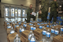 Sergeant Pascal Johanny from 4 Engineer Support Regiment takes inventory of rations and water at Canadian Armed Forces Base Trenton on November 13, 2013 to ensure there is enough for every soldier prior to embarking on a plane with other members of the Disaster Assistance Response Team, to help the Philippine Islands that were ravaged by Typhoon Haiyan. Photo IS2013-3042-01: MCpl Patrick Blanchard, Canadian Forces Combat Camera