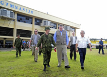 Major Bob Mead, The Honourable Christian Paradis, Minister of International Development and Minister for La Francophonie, and the Honourable Victor A. Tanco, the Governor of Capiz walk though the Canadian camp in Roxas, Philippines on November 26, 2013 during Operation RENAISSANCE. Photo: Corporal Darcy Lefebvre, Canadian Forces Combat Camera IS2013-6015-05 
