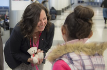 Michelle Cameron, Canada’s Ambassador to Lebanon, hands out teddy bears to a Syrian refugee child, as the Syrian refugees prepare to depart Lebanon to resettle into Canada in accordance to the Government of Canada’s Operation PROVISION on December 10, 2015.  Photo: Corporal Darcy Lefebvre, Canadian Forces Combat Camera.