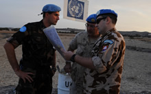 Sector 4, Buffer Zone, Cyprus. 24 November 2008 – Captain Michael Solonynko, Operation and Information Analyst Officer for the UN HQ in Cyprus, discusses the route to the next location with Captain Slovomir Smidl from Slovakia (right) and Lieutenant Laslo Cziko from Hungary. (photo by: MCpl Robert Bottrill, Canadian Forces Combat Camera)