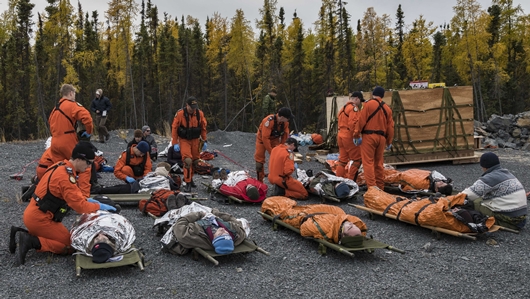 Yellowknife, Northwest Territories. September 17, 2018 - Search and Rescue Technicians tend to simulated causalities during Exercise READY SOTERIA, an exercise designed to evaluate the Canadian Armed Forces response to a major air disaster. (Photo: AB Erica Seymour, 4 Wing Imaging)