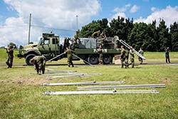 Approximately 100 soldiers  from Joint Task Force (East) build a temporary camp to accommodate asylum seekers near the Saint-Bernard-de-Lacolle border crossing in Quebec during Operation ELEMENT, August 9, 2017. Photo: Corporal Djalma Vuong-De Ramos, BAP 2 DIV CA / JTF (East)